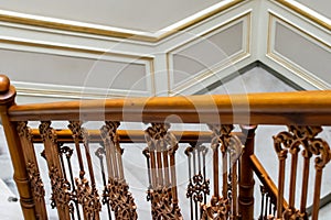 wooden brown old railing on marble stairs