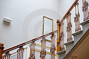 wooden brown old railing on marble stairs