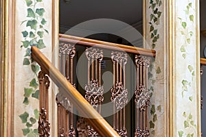 wooden brown old railing on marble stairs