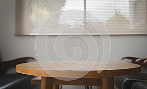 Wooden brown table in the room for meeting and drinking coffee