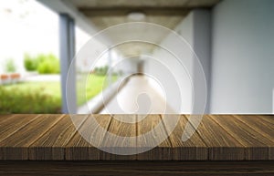 Wooden brown table top against the blurred corridor, passage and courtyard of the house .For product display montage or design is