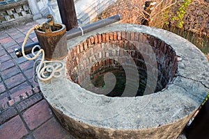 Wooden Bucket String Rope Old Water Well Rim Brick Wall