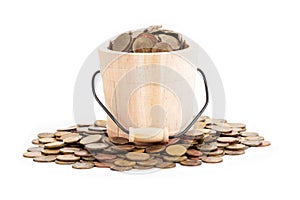 Wooden bucket and coins on white background.Time to invest, time value for money, family planning, money saving, finance saving