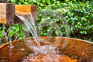 Wooden bucket for foot bath in hot spring garden, onsen, soft-focus.4k