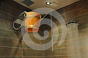 Wooden bucket in shower photo