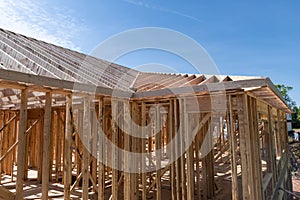 Wooden building in blue sky,New residential construction home framing.