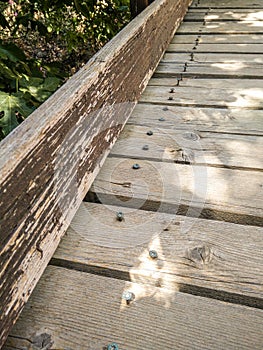 Wooden buildings. Detail with screws torn off the floorboards of an old wooden deck