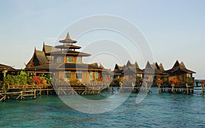 wooden bungalows over sea water