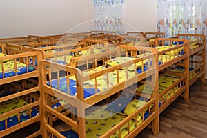 Wooden bunk beds for children in the kindergarten