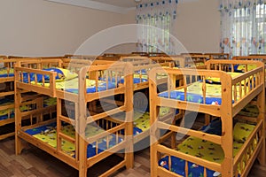 Wooden bunk beds for children in the kindergarten