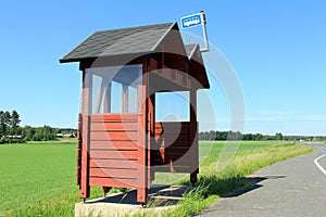 Wooden Bus Stop Shelter by Highway