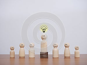 Wooden business figure with light bulb for leadership, creative, idea, innovation concept