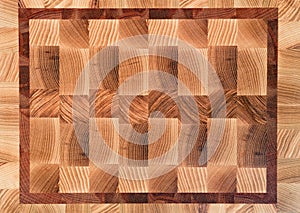 Wooden butcher chopping block, natural end wood board texture background pattern close up