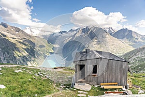 Wooden cabin with amazing view of glacier reservoir in summer