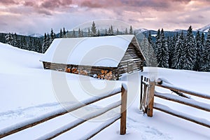 Wooden cabin hut in winter