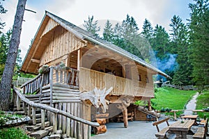 Wooden cabin with tourists at Hija Glamping Lake Bloke in Nova Vas, Slovenia photo