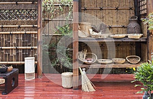 Wooden cabinet and bamboo gate in Oriental garden