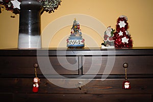 Wooden cabinet with Christmas decorations and christmas muggle carousel