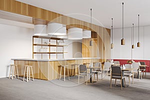 Wooden cafe with counter, table and chairs in open space restaurant