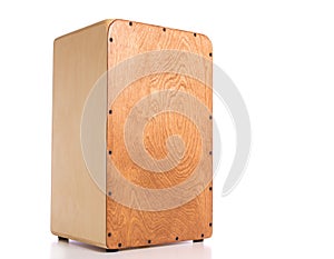 A wooden Cajon on a white background