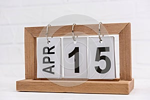 Wooden calendar with date 15th of April, Tax day
