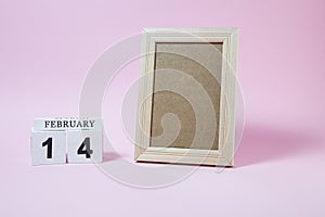 Wooden calendar and frame with empty space for text or picture