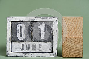 Wooden calendar made of cubes with the date June 01.