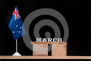 Wooden calendar of March with Australian flag on black background. Holidays of Australia in March