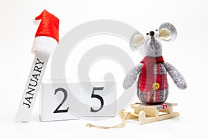 Wooden calendar with number January 25. Happy New Year! Symbol of New Year 2020 - white or metal silver rat. Christmas decorated
