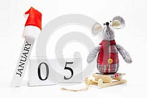 Wooden calendar with number January 5. Happy New Year! Symbol of New Year 2020 - white or metal silver rat. Christmas decorated