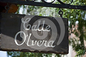 Wooden Calle Olivera street sign in Los Angeles, California