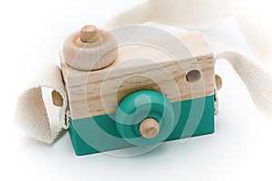 Wooden camera toy isolated on white background