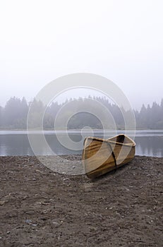 A wooden canoe on a beach