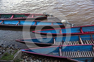 Wooden canoe in river port