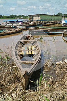 Wooden canoe in river port