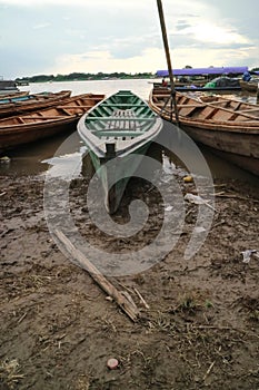 Wooden canoe in river port