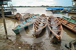 Wooden canoe in river port