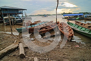 Wooden canoe in river port