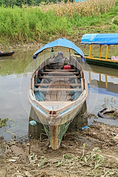 Wooden canoe in river port