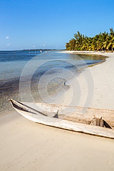 Wooden canoe on the tropical beach