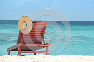 Wooden canvas chair on a beautiful tropical beach