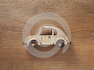 Wooden car toy with curvy shape photo