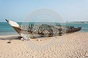 Wooden carcass of dhow fishing boat photo