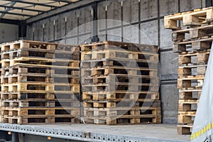 Wooden cargo pallets arranger at a truck photo