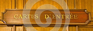 A wooden cartes d`entree sign