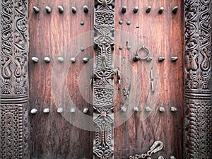 Wooden carved door in Stone Town, Zanzibar photo