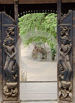 Wooden carved open door
