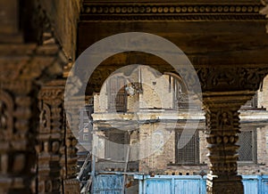 Wooden carved pillars and arch in the temple of Durbar square at Patan Kathmandu, Nepal