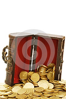 Wooden casket full of coins