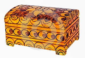 Wooden casket in orange and yellow with visible dark decorations